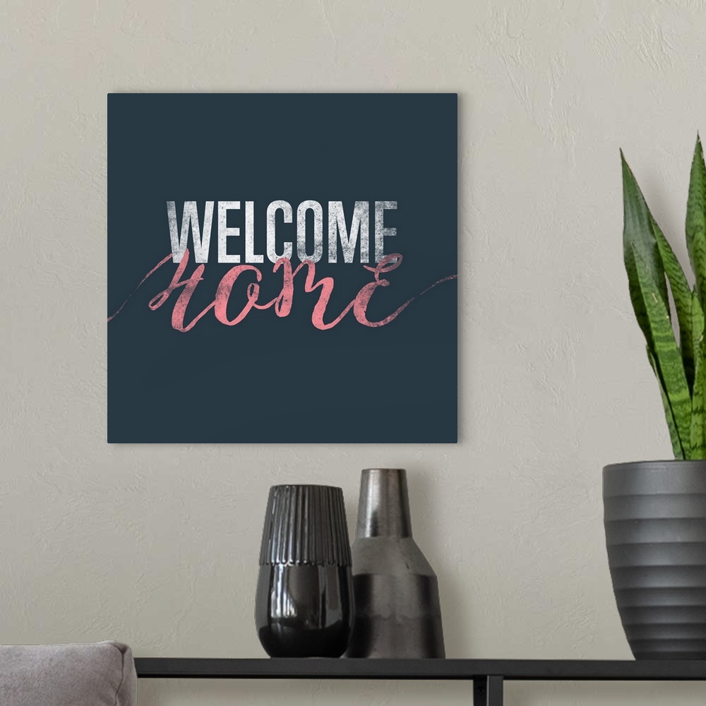 A modern room featuring "Welcome Home" in white and pink on a dark teal background.