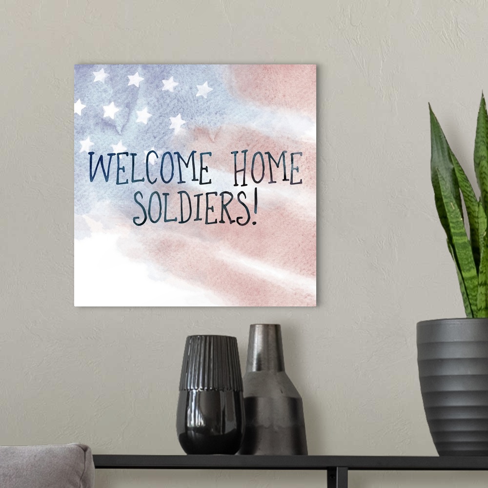 A modern room featuring "Welcome Home Soldiers!" written on top of a watercolor American flag.