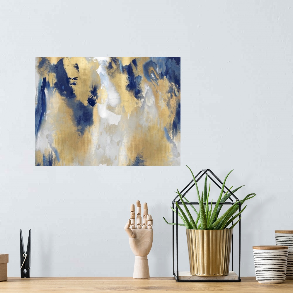 A bohemian room featuring A large, horizontal abstract painting in shades of indigo and gold. This statement piece of art w...