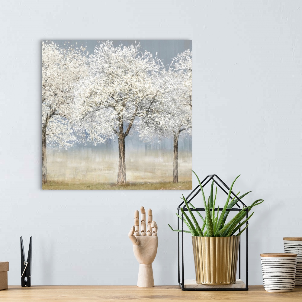 A bohemian room featuring A contemporary painting of a small stand of trees covered in white spring blossoms. The trees sta...