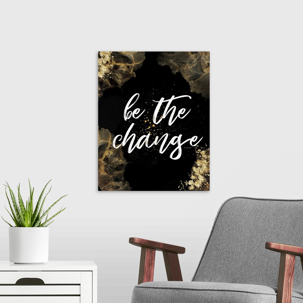 A modern room featuring Be the Change