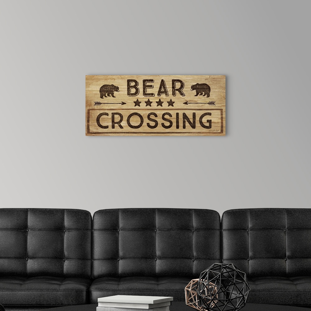 A modern room featuring Contemporary cabin decor artwork of a wooden sign for Bear Crossing.