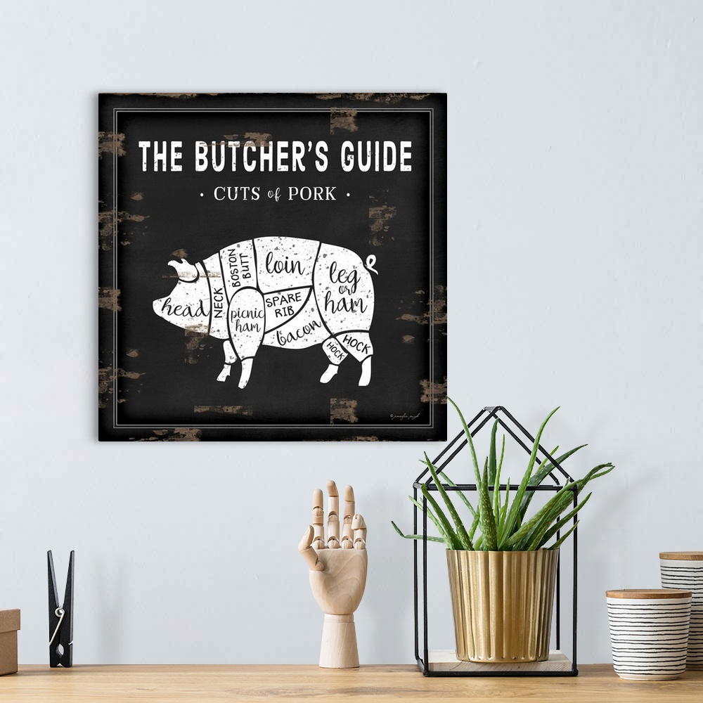 A bohemian room featuring Rustic square chart showing cuts of pork in black and white.