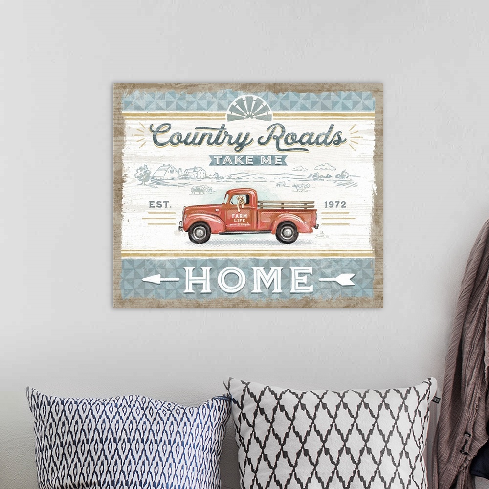 A bohemian room featuring Vintage farmhouse signage of a rustic red truck evokes a classic country style