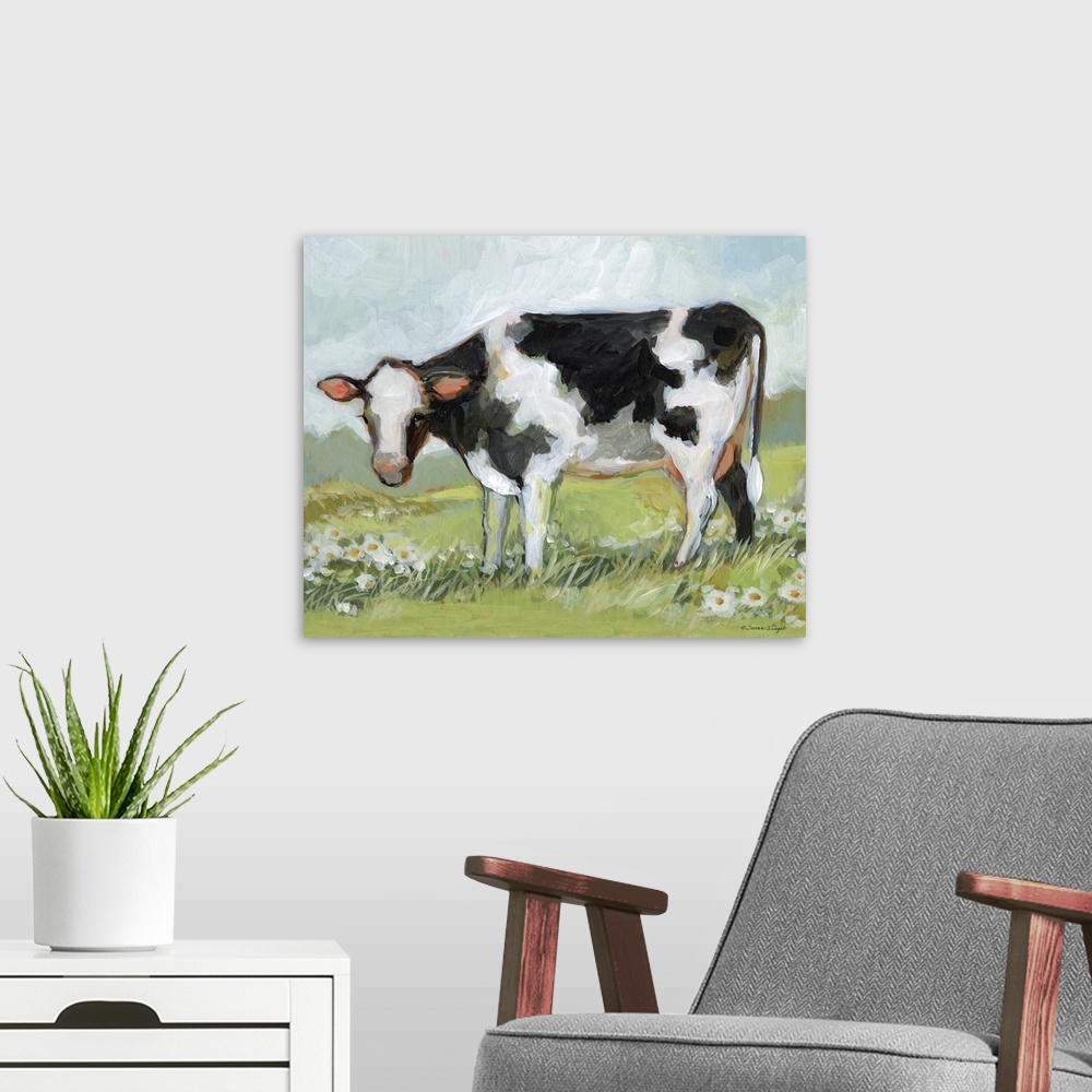 A modern room featuring A black & white cow enjoys his pastoral setting!