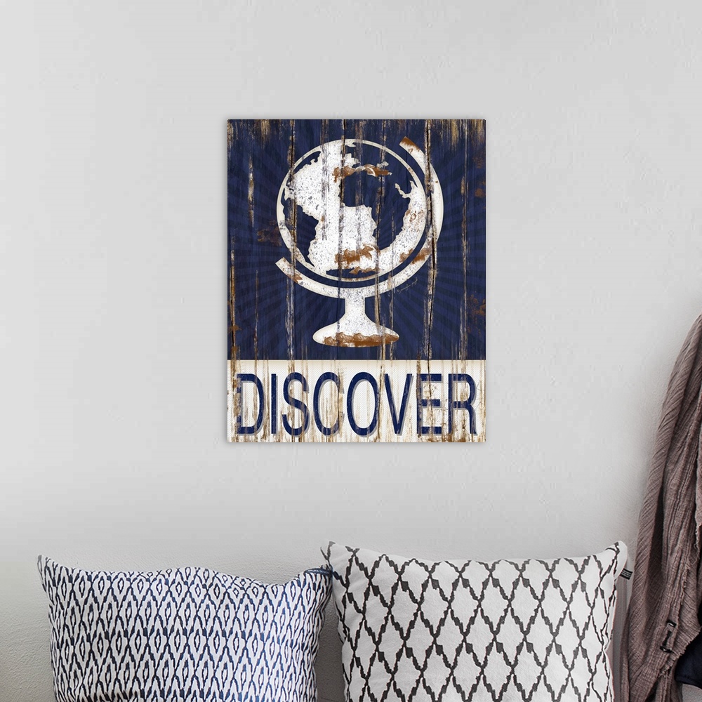 A bohemian room featuring This distressed decor features a globe with the word, "Discover" underneath.