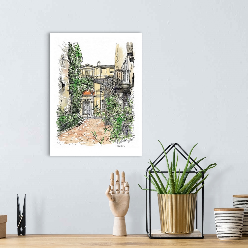A bohemian room featuring A lovely pen and ink depiction of a European back street.