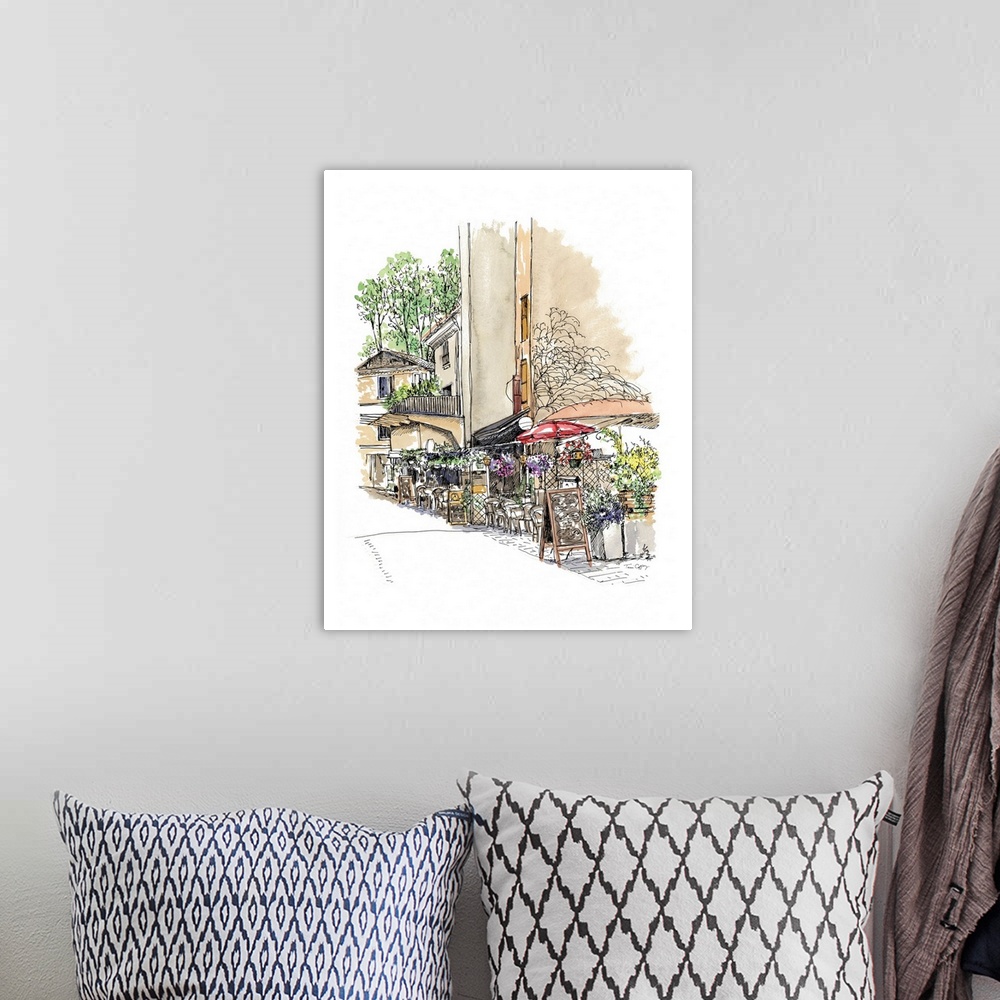 A bohemian room featuring A lovely pen and ink depiction of a European street scene.
