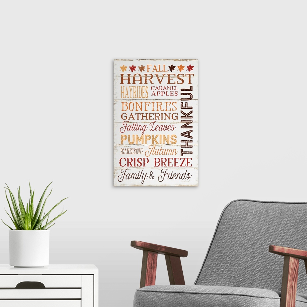 A modern room featuring Thanksgiving themed typography artwork in festive fall colors against a rustic wooden background.