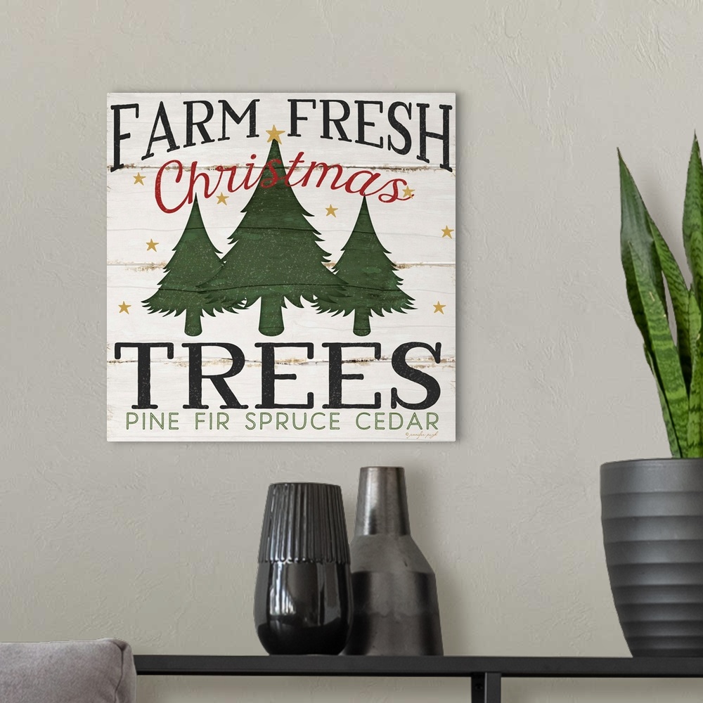 A modern room featuring Christmas themed typography artwork in festive seasonal colors.