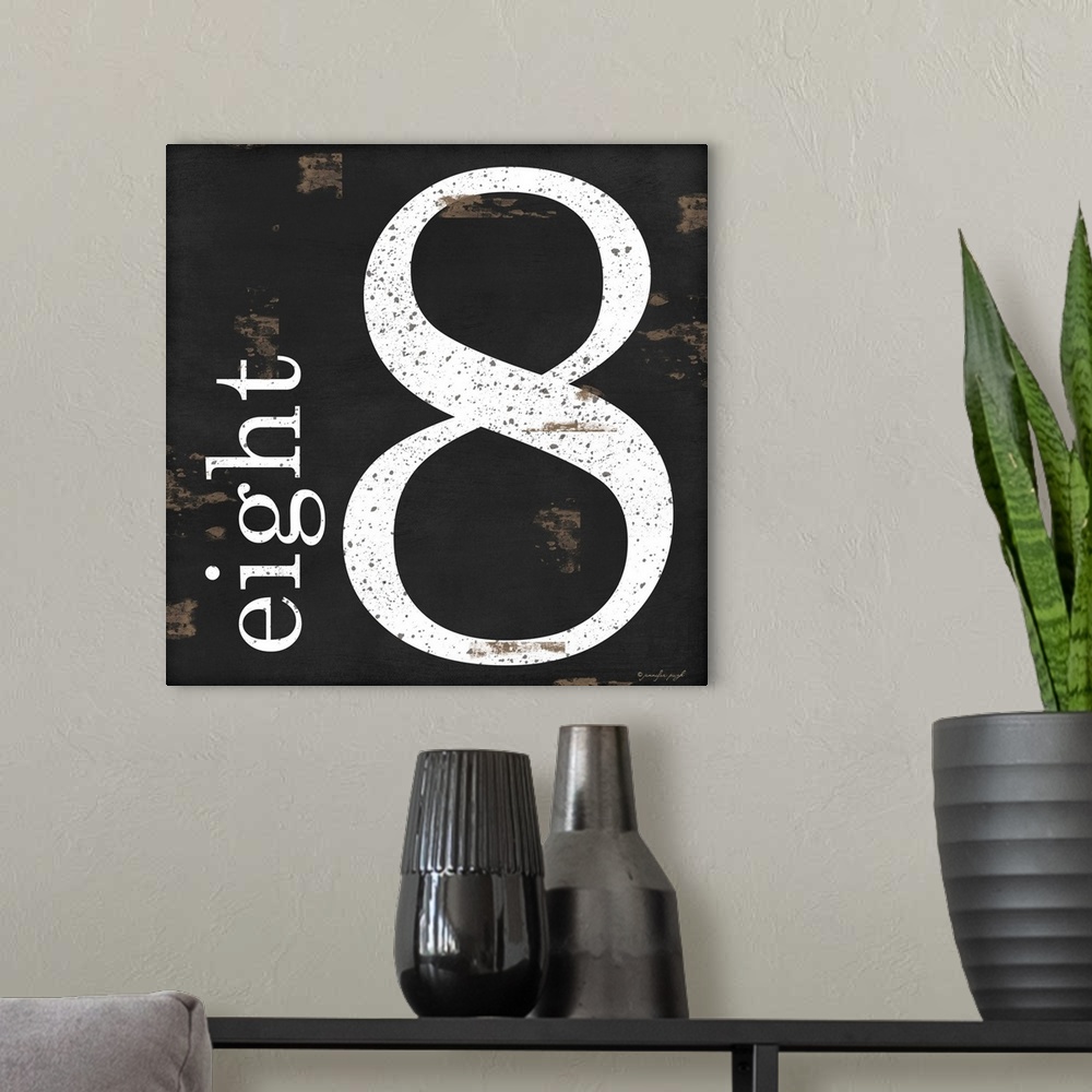A modern room featuring Graphic art with the number eight bold and large in the center, and the word eight written smalle...