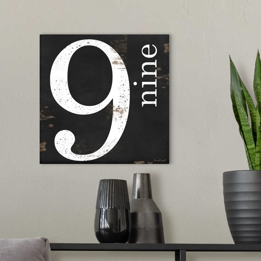 A modern room featuring Graphic art with the number nine bold and large in the center, and the word nine written smaller,...