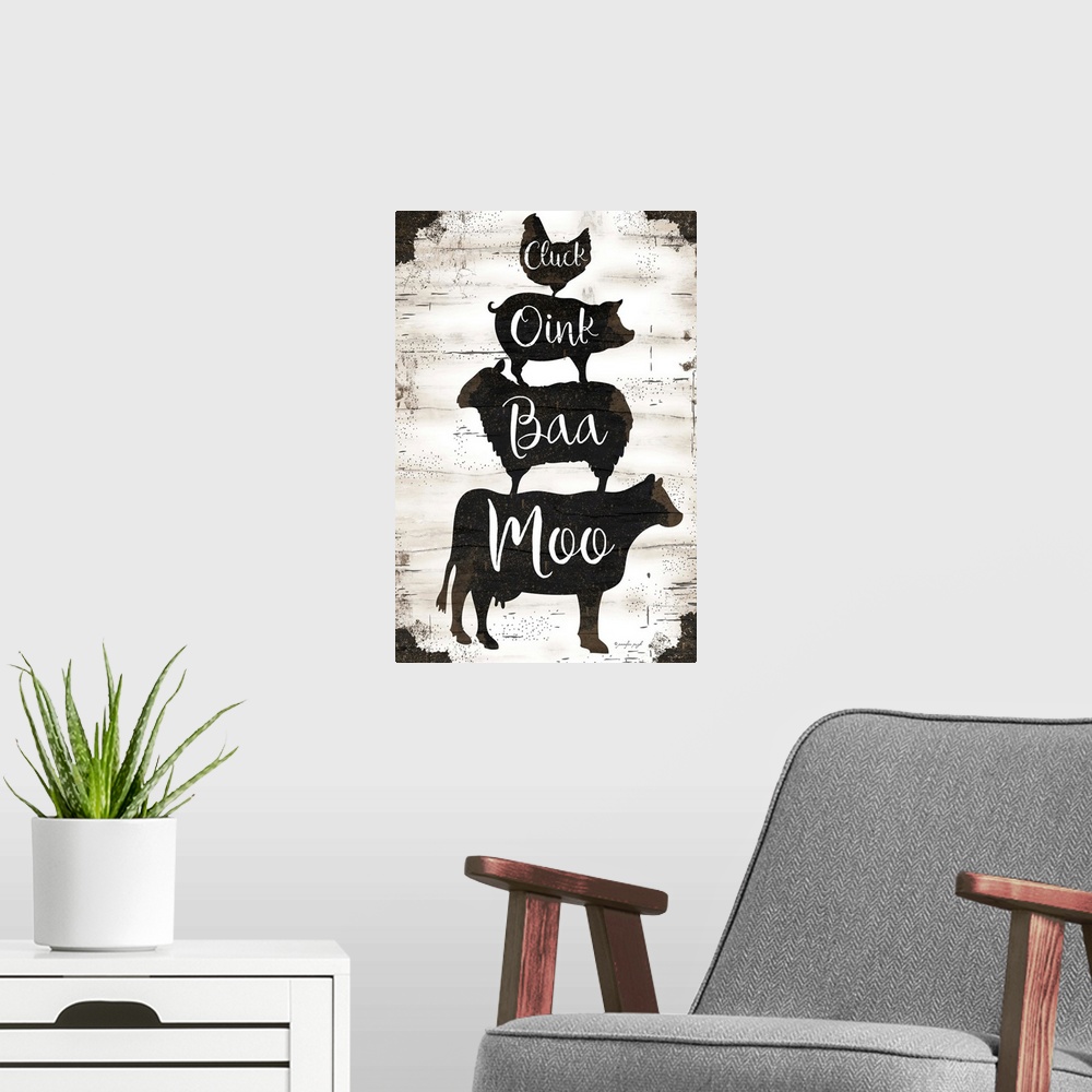 A modern room featuring Graphic art of silhouettes of a cow, sheep, pig and chicken, stacked upon one another, with scrip...
