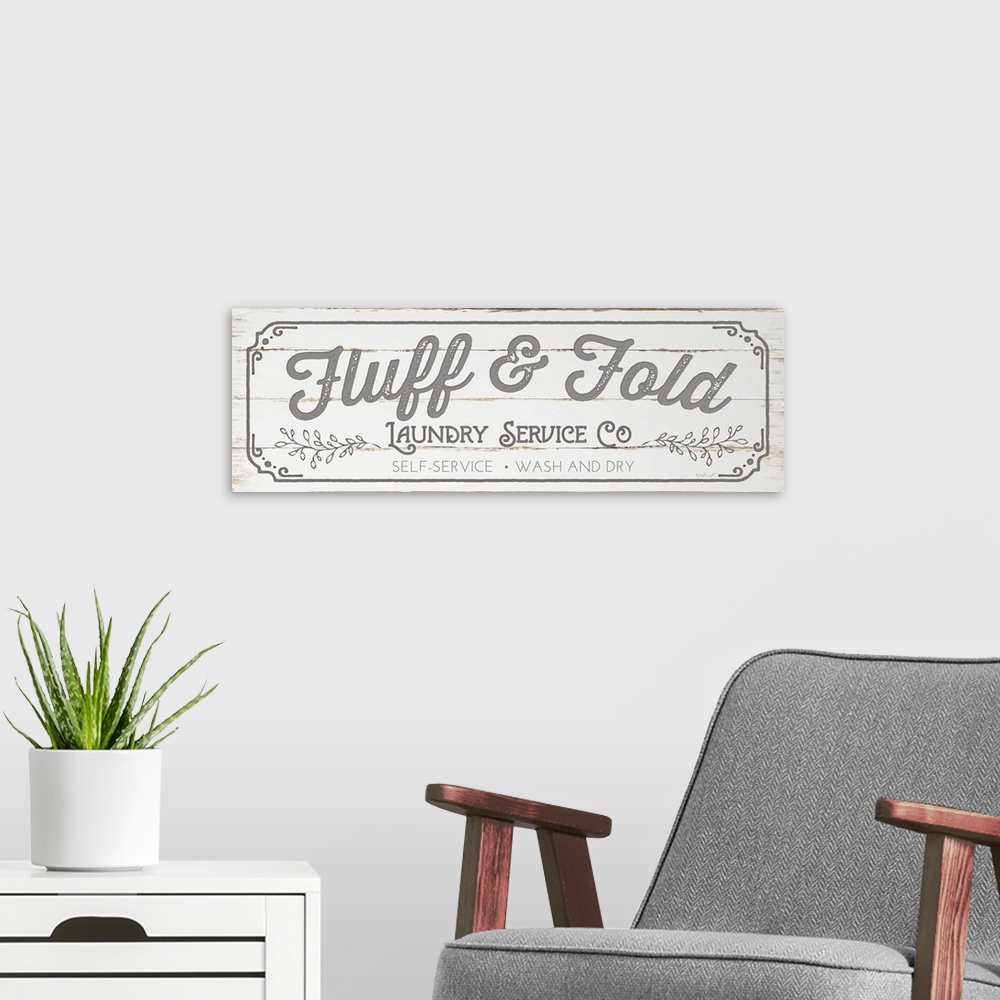 A modern room featuring Typographic laundry art on a shiplap wood background.