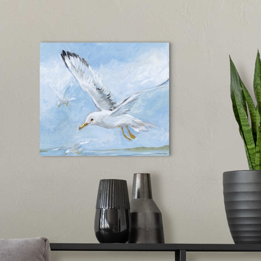 A modern room featuring Seagulls soar through the blue sky.