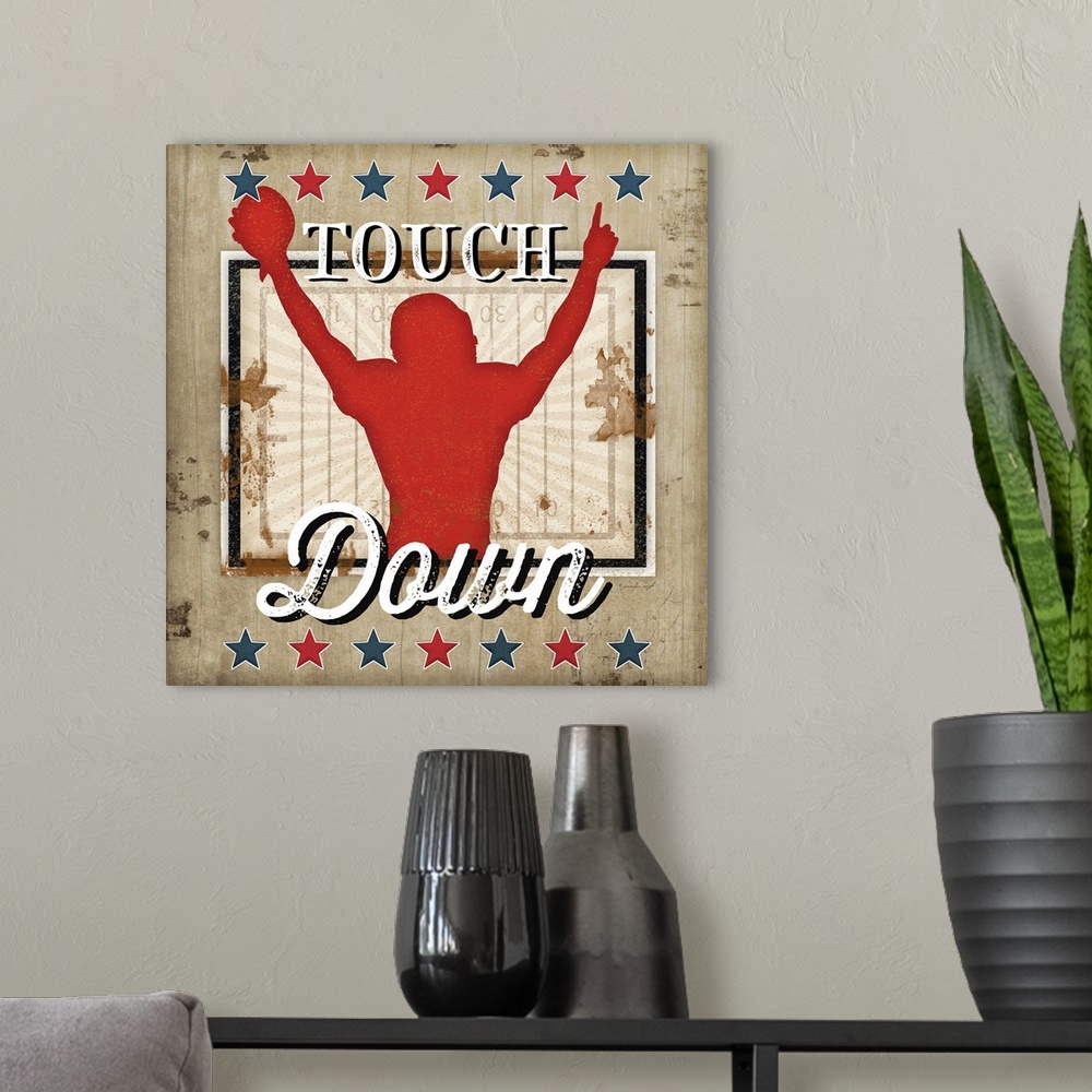 A modern room featuring Distressed themed artwork of football with the word, "Touchdown" .