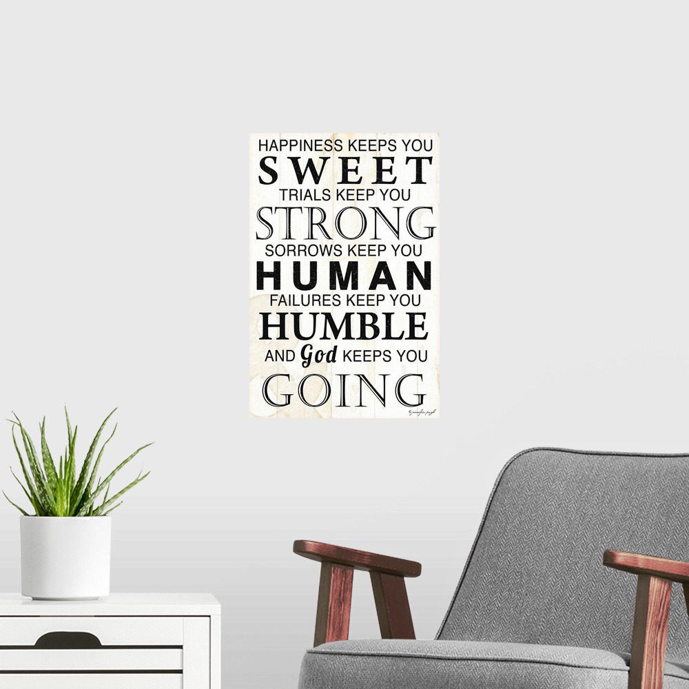 A modern room featuring Oversized vertical wall art of text reading ""happiness keeps you sweet, trials keep you strong, ...