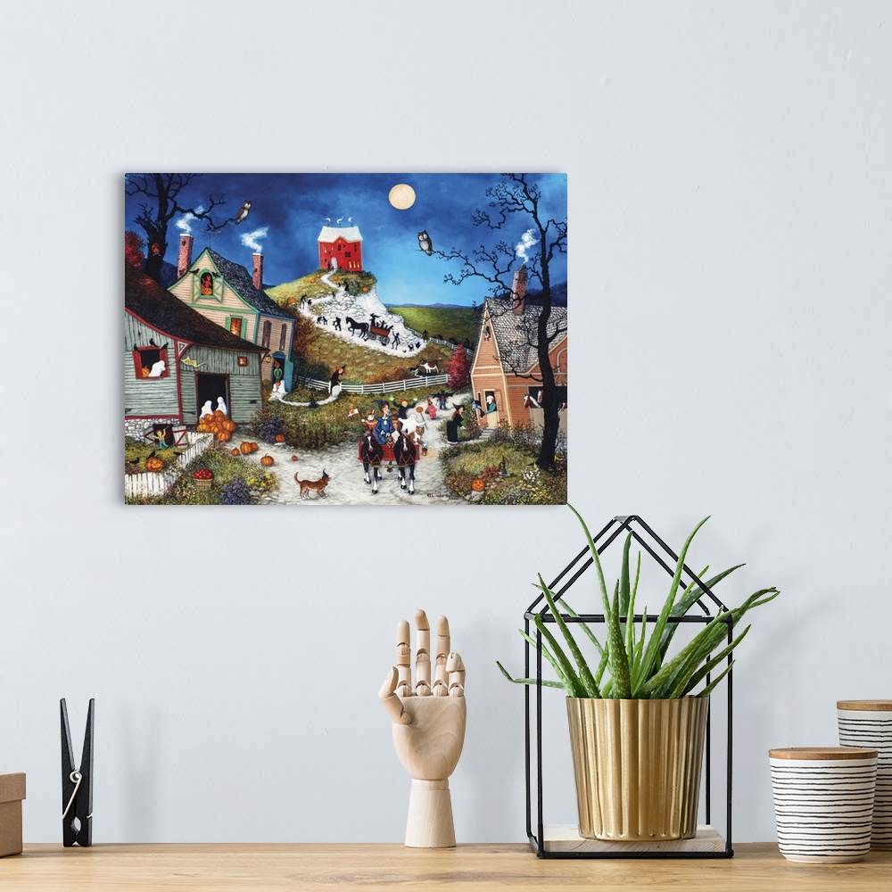 A bohemian room featuring A contemporary painting of a countryside village scene at Halloween.