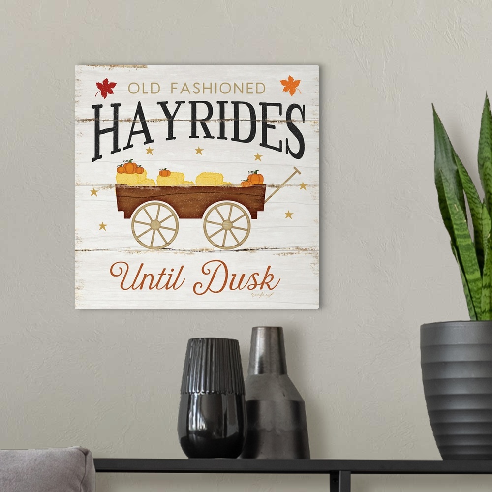 A modern room featuring Rustic fall themed decor with the words, "Old fashioned hayrides until dusk" .