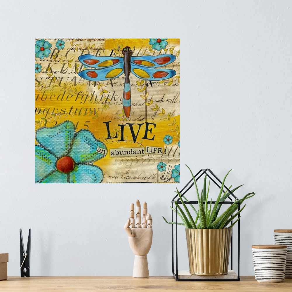 A bohemian room featuring Square, oversized home art docor in vibrant colors, of various flowers and a large dragonfly over...