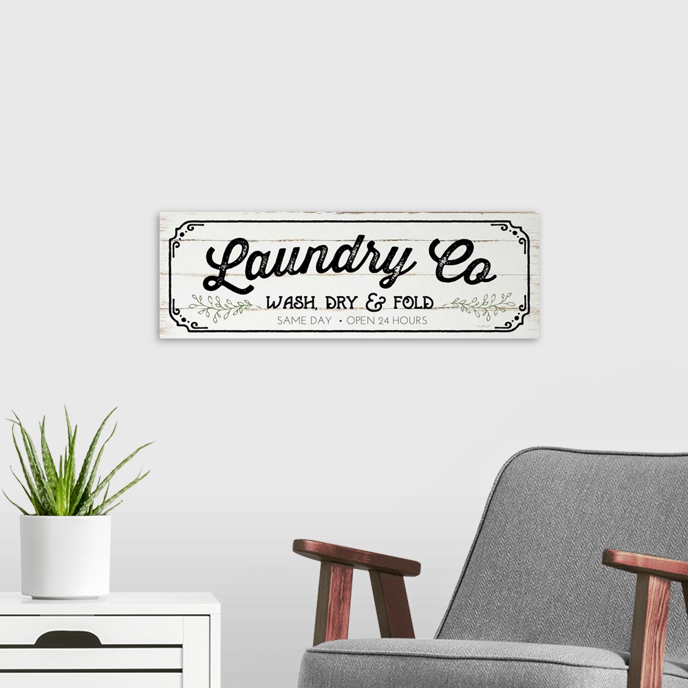 A modern room featuring Typographic laundry art on a shiplap wood background.