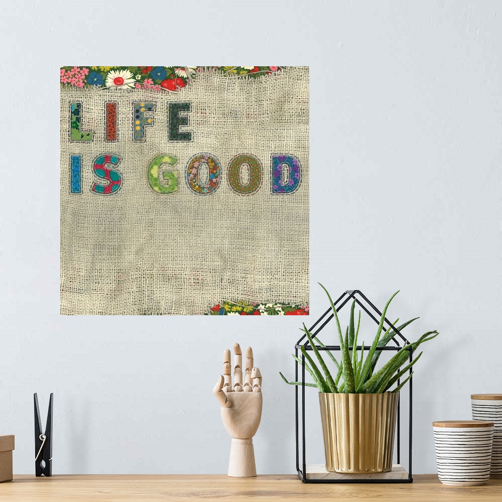 A bohemian room featuring Inspirational, motivational wall decor with colorful, textural treatment