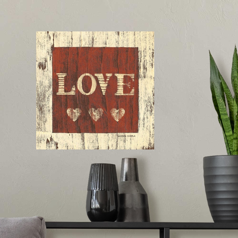 A modern room featuring Inspirational artwork of the word ""LOVE"" with three hearts underneath in a red square painted o...
