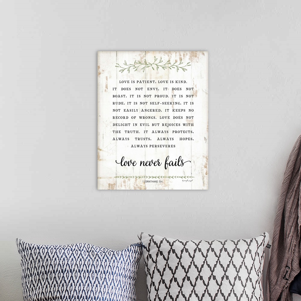 A bohemian room featuring The verse, 1 Corinthians 13:4, is black text on a distressed white background that is concluded w...