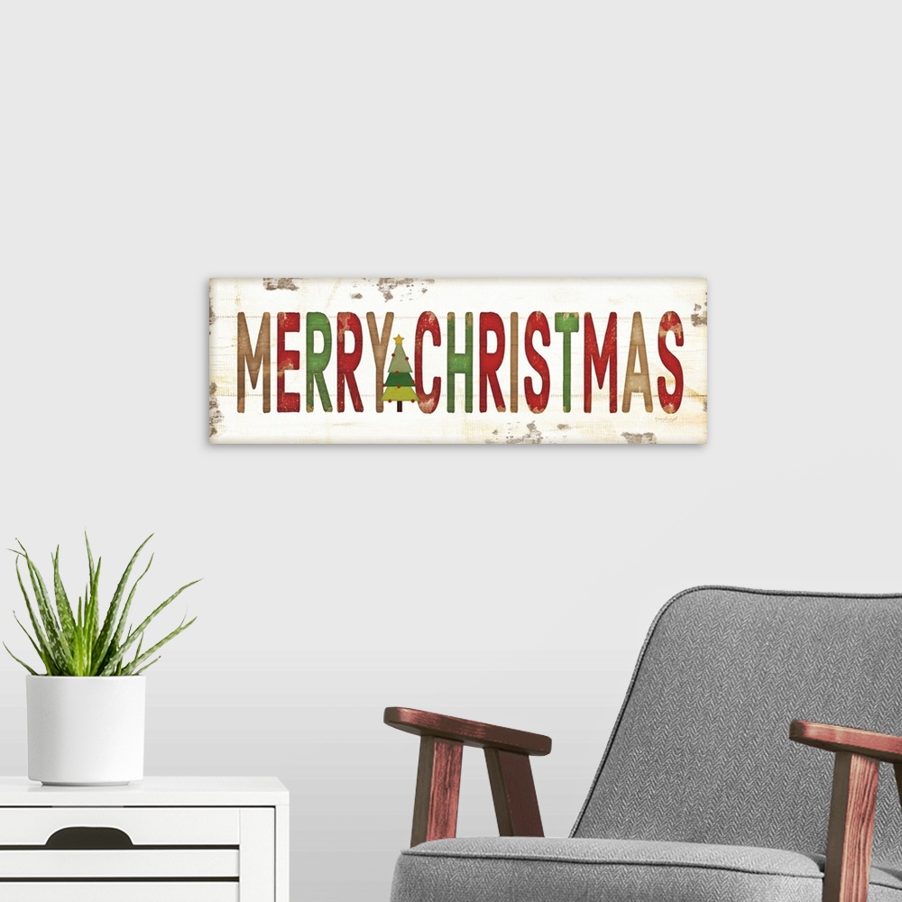 A modern room featuring Christmas themed typography artwork in festive seasonal colors against a distressed background.