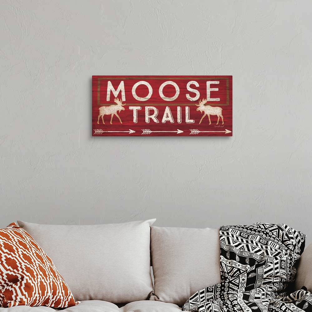 A bohemian room featuring Contemporary cabin decor artwork of a wooden sign for Moose Trail.