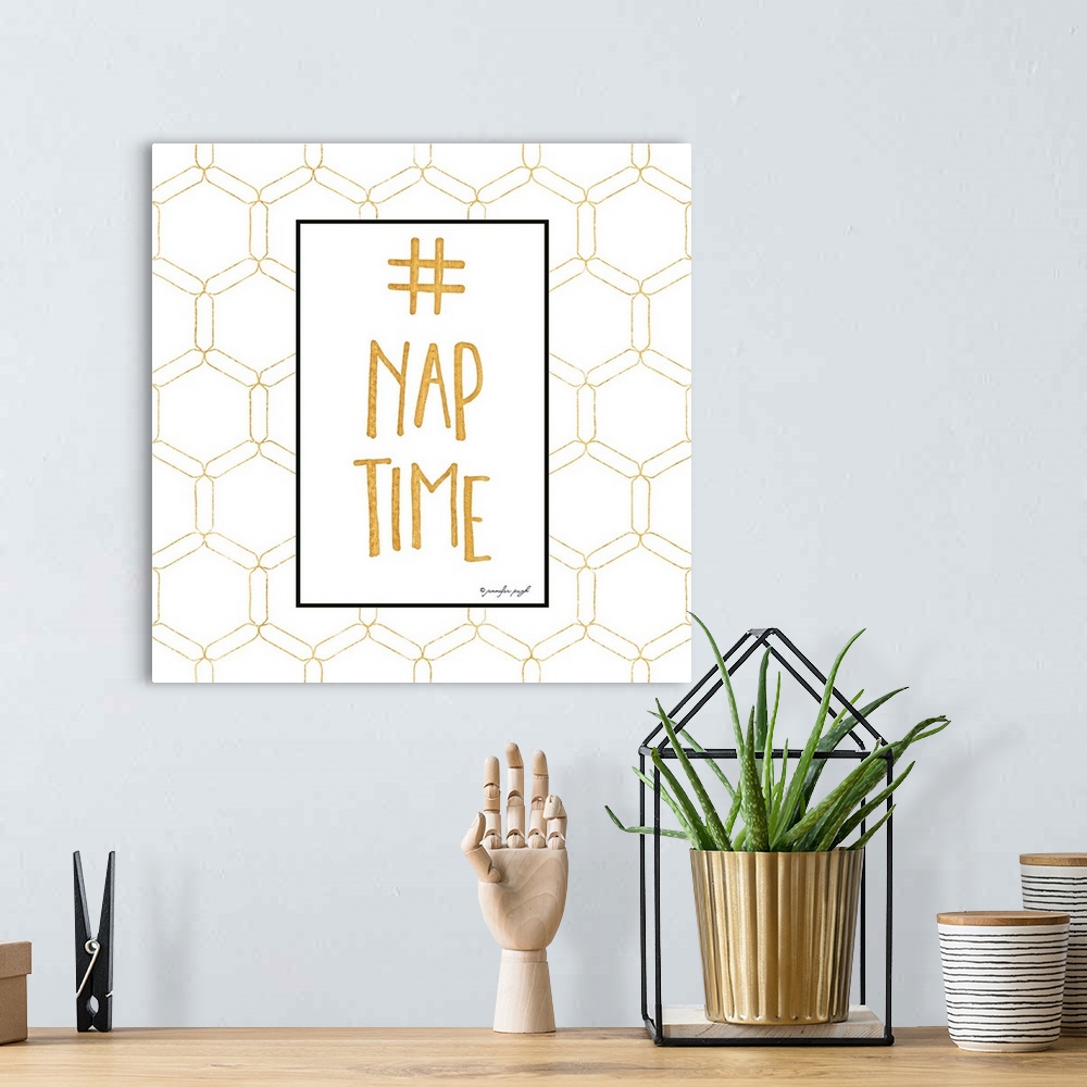A bohemian room featuring Graphic art with golden text in a vertical rectangular box, on a white background covered with a ...