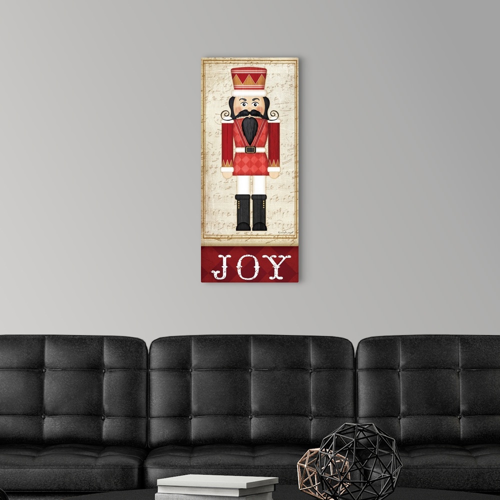 A modern room featuring Holiday themed home decor artwork of a nutcracker wearing a red tunic above the word Joy.