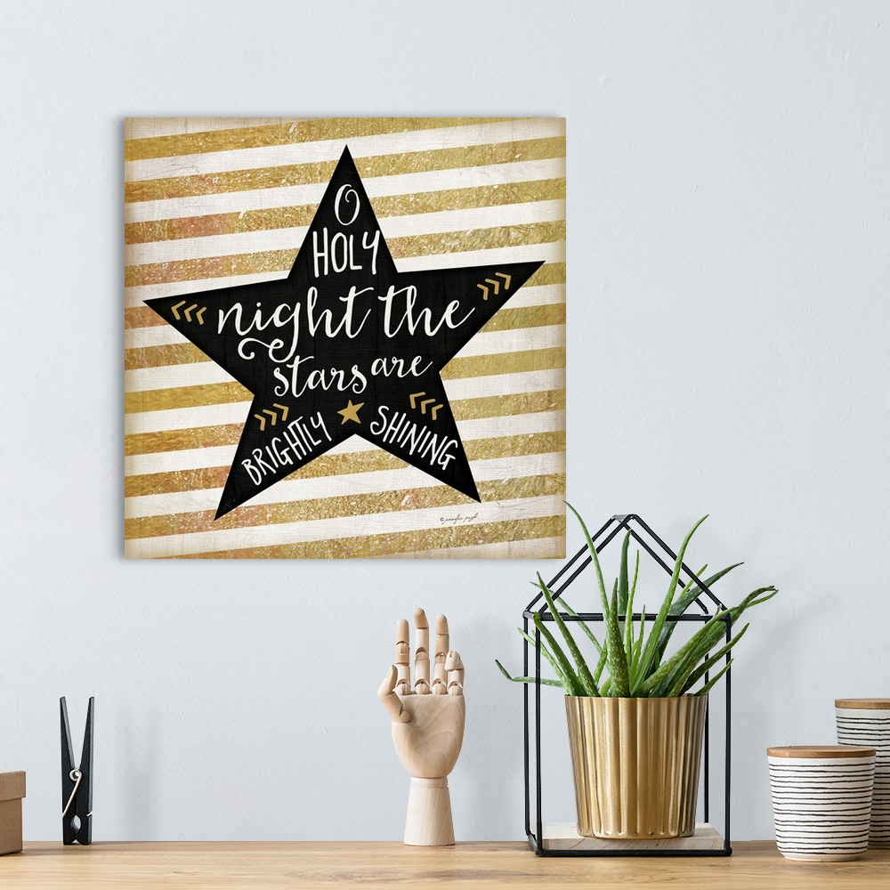 A bohemian room featuring Contemporary artwork of a black star with white handlettering against a background of gold and wh...
