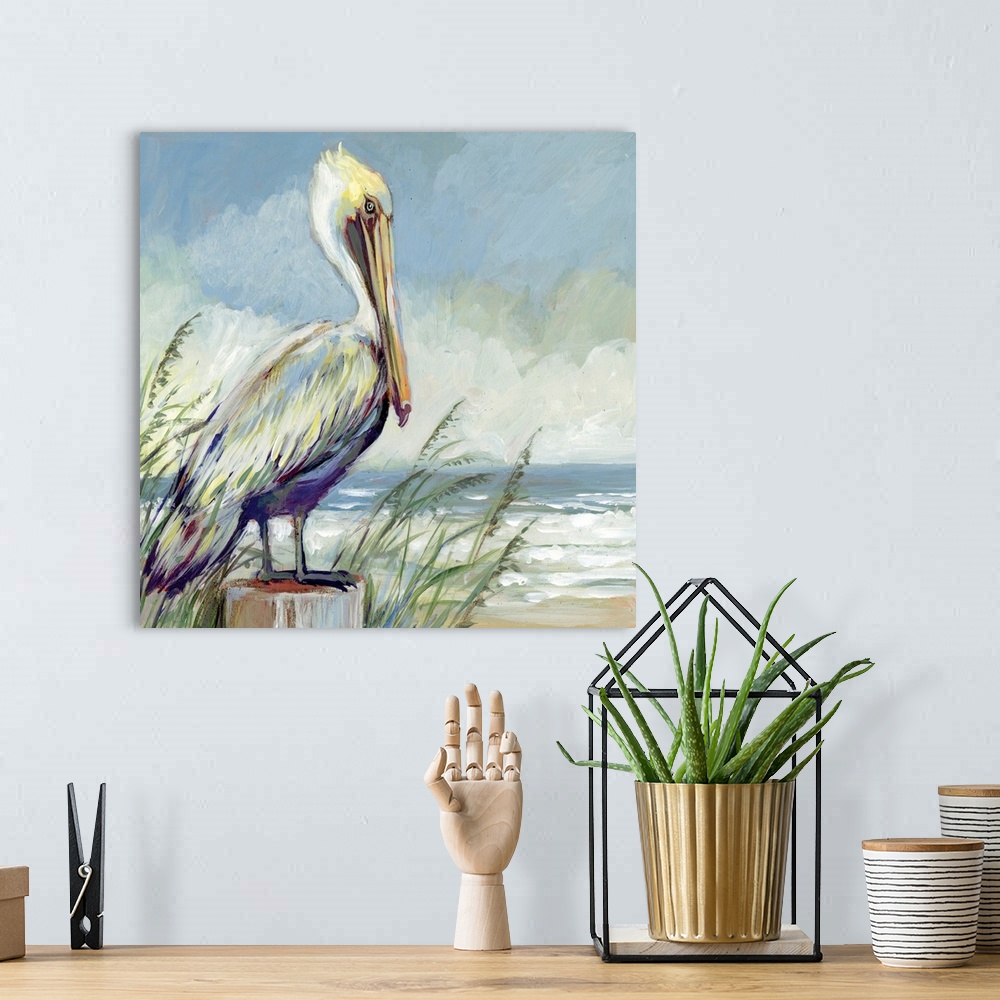 A bohemian room featuring A striking pelican sits and watches the tide.