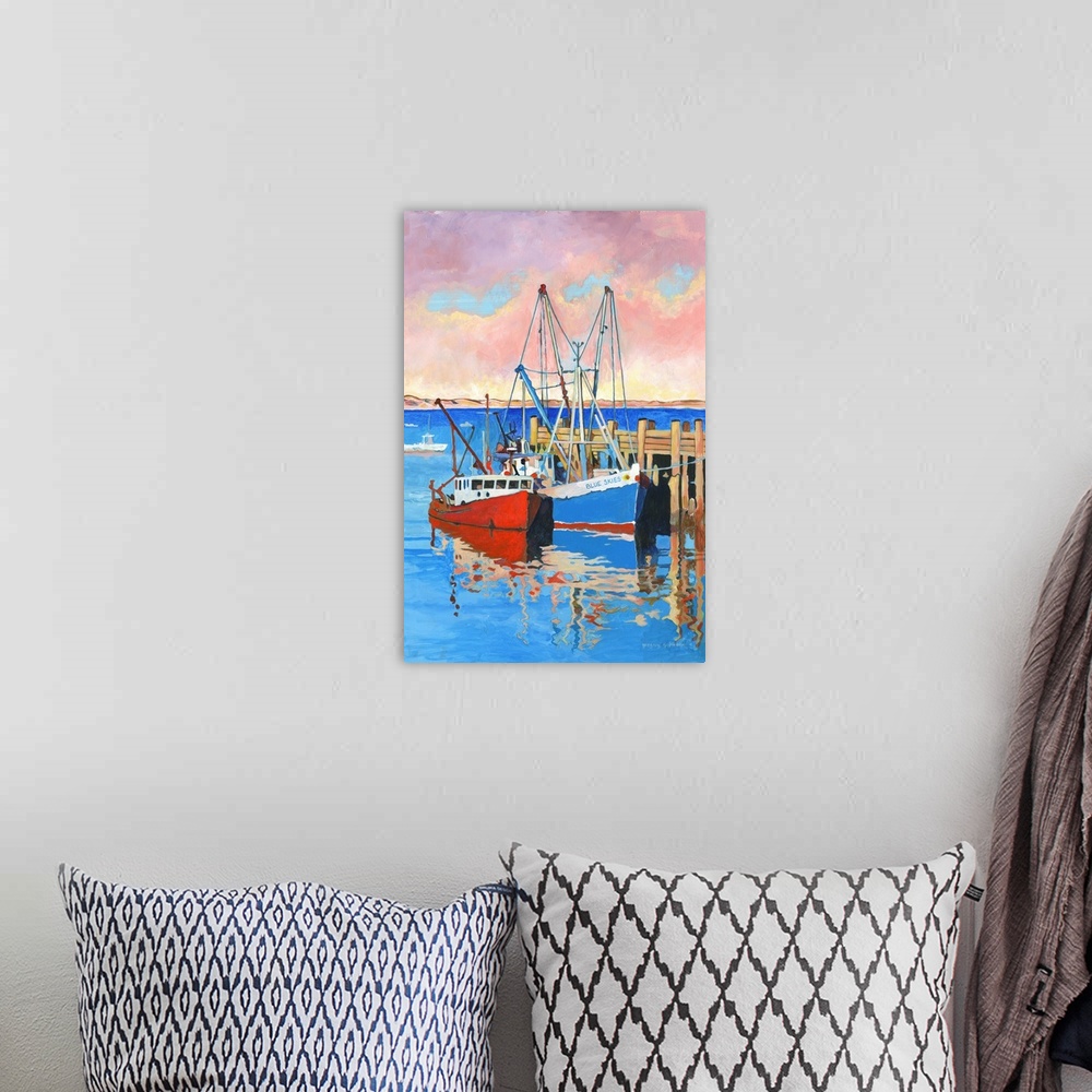 A bohemian room featuring A moody artistic boat scene captures the mystery of the sea.