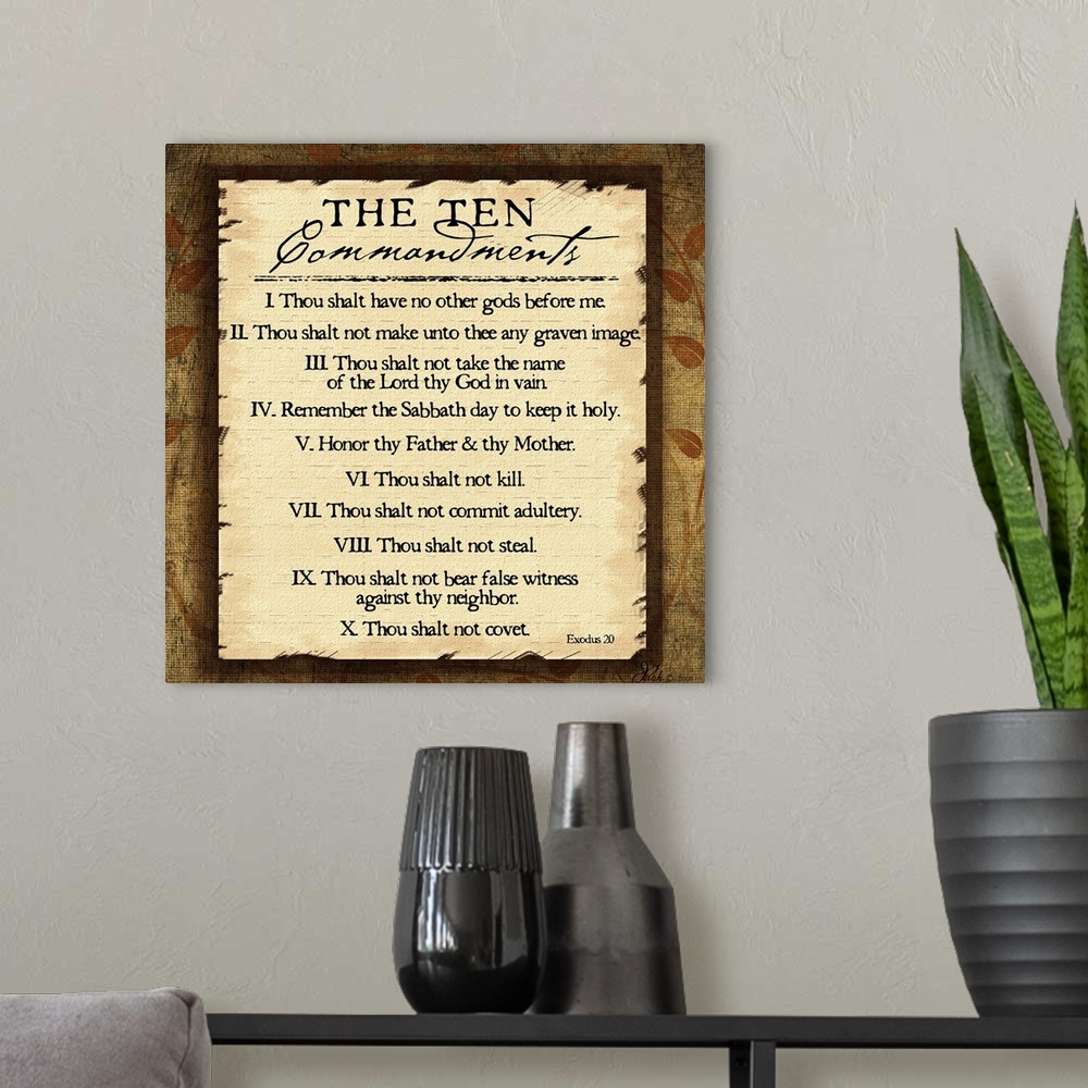 A modern room featuring This large square piece lists the ten commandments with a decorative border around them.