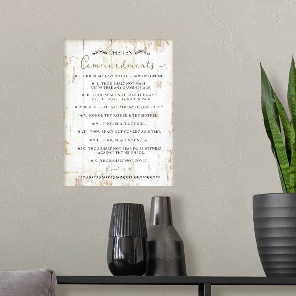 A modern room featuring The Ten Commandments on a white shiplap wood background.