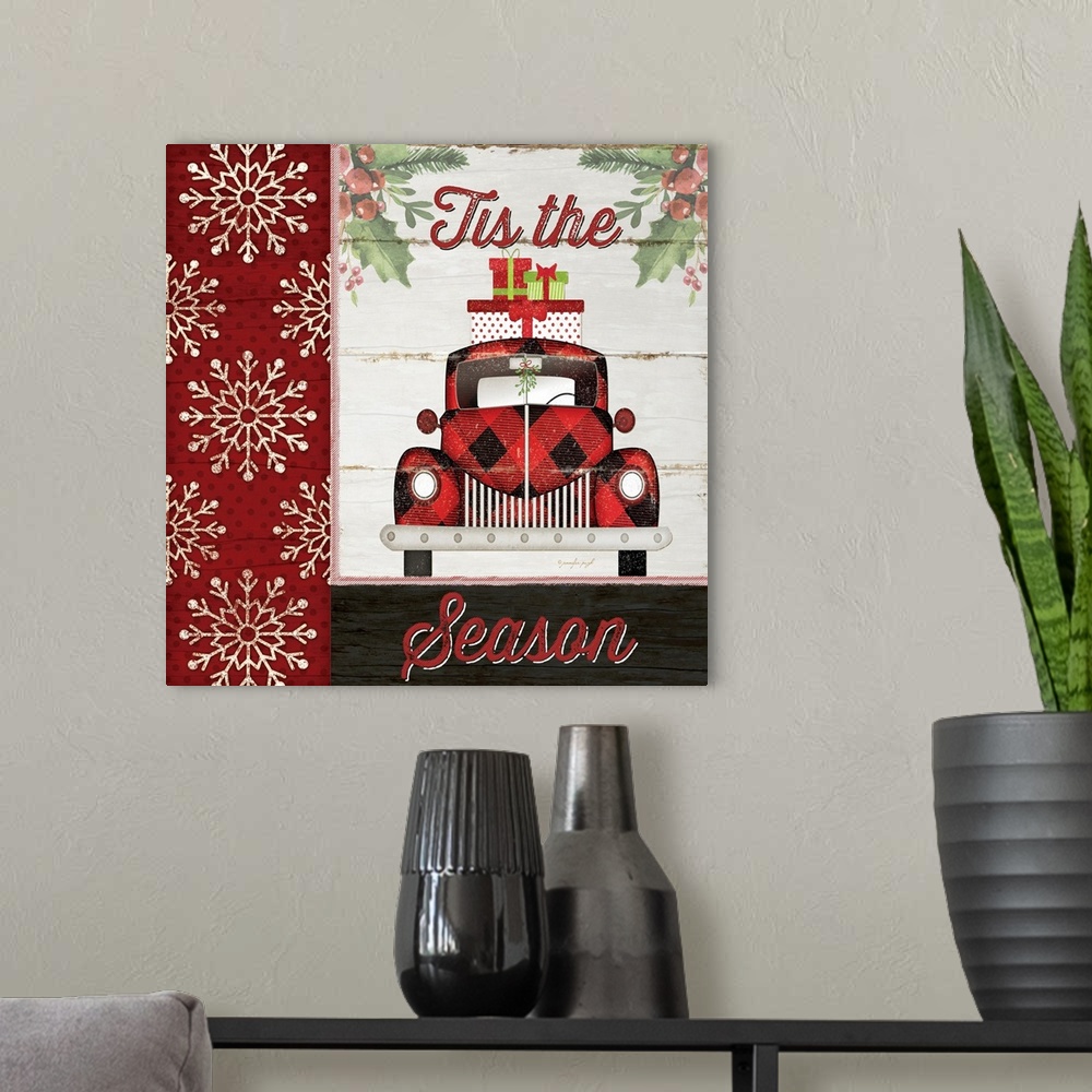 A modern room featuring This holiday decor features a plaid patterned truck with presents piled on top and the jubilant p...