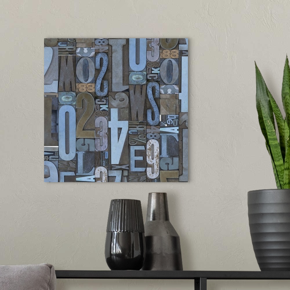 A modern room featuring Abstract canvas print of random numbers and letters arranged together in varying directions and s...
