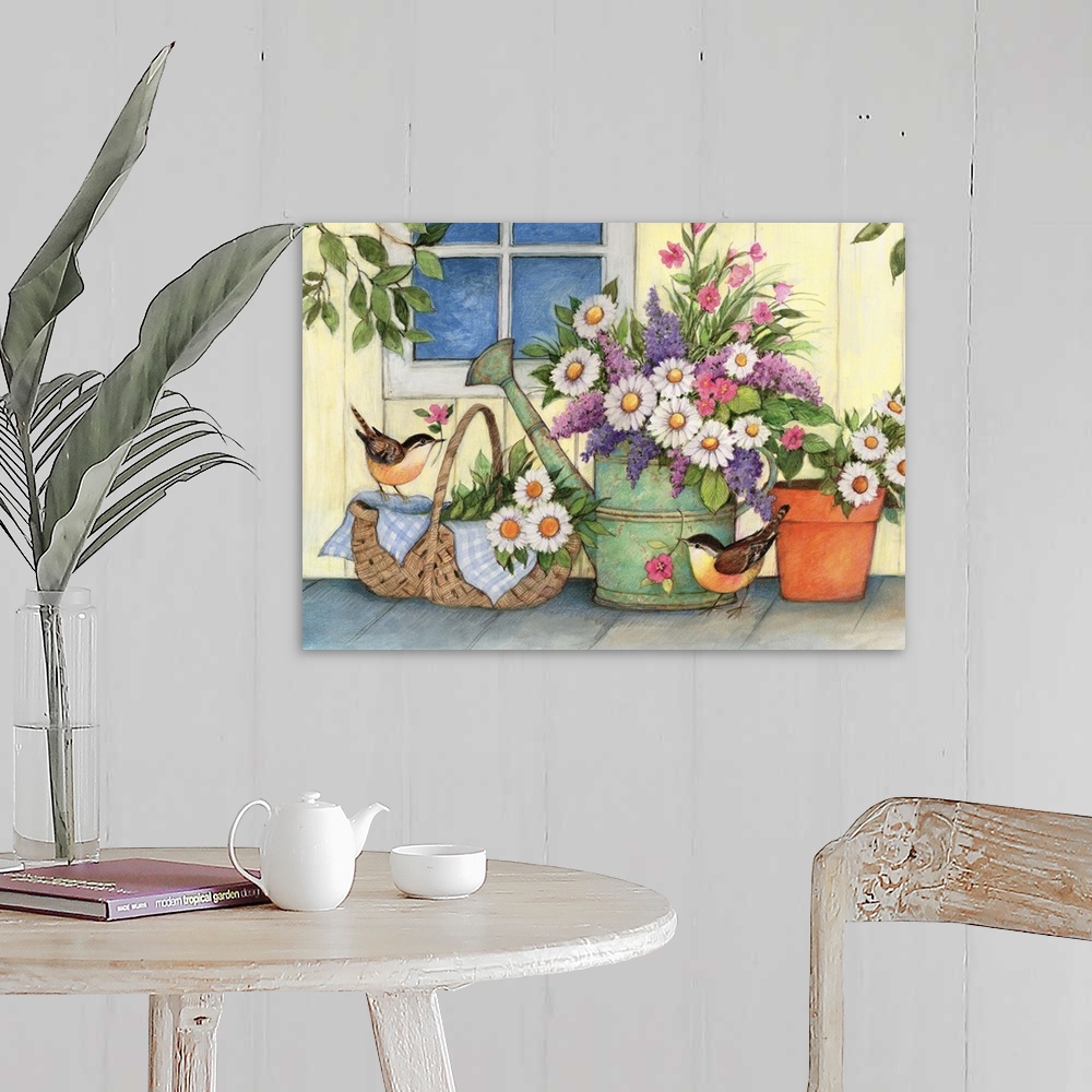 A farmhouse room featuring A sweet country vignette of a watering can scene.