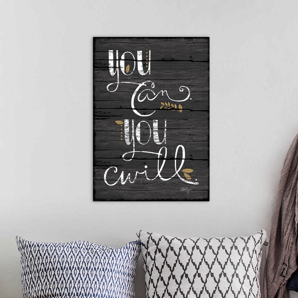 A bohemian room featuring Font-driven art, neutral colors and a great message!