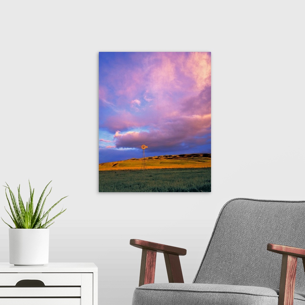 A modern room featuring A windmill is dwarfed by enormous violet clouds in Ventura County, California.