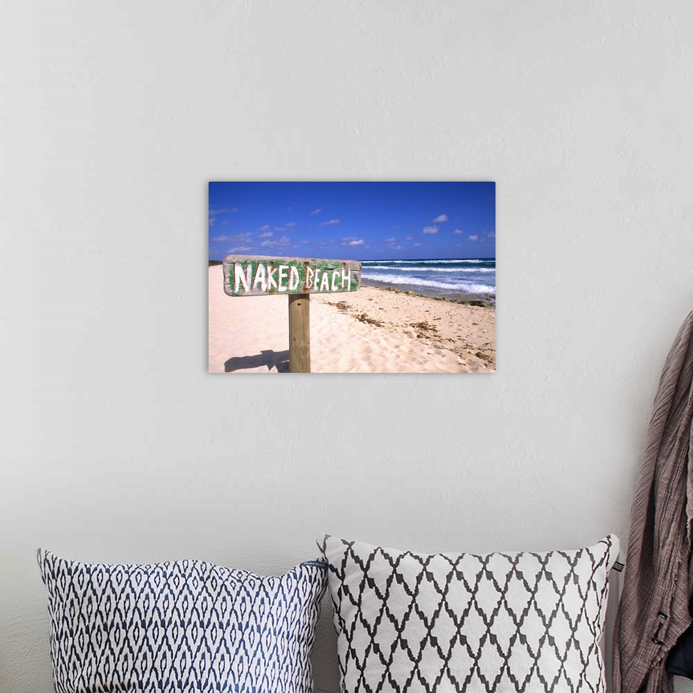 A bohemian room featuring Abstract of naked beach sign in Cozumel Mexico.