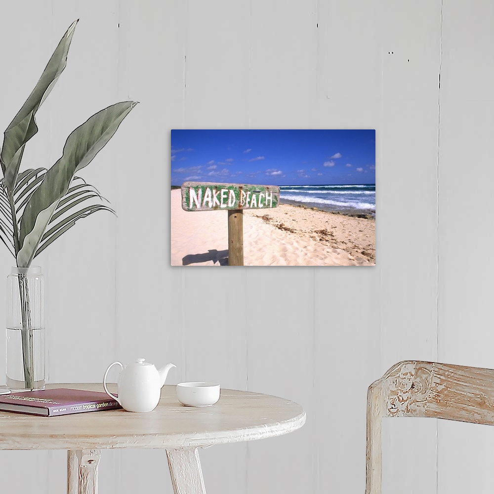 A farmhouse room featuring Abstract of naked beach sign in Cozumel Mexico.