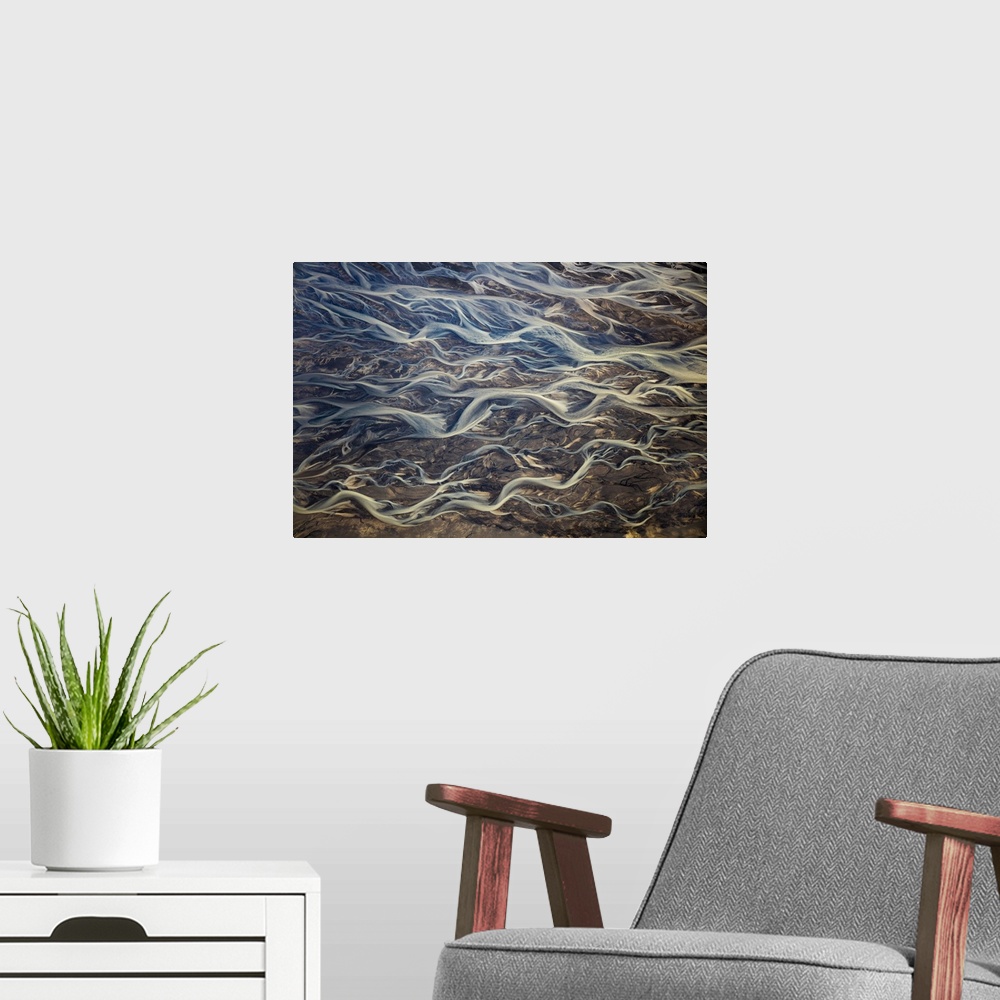 A modern room featuring Aerial of braided rivers, Iceland.
