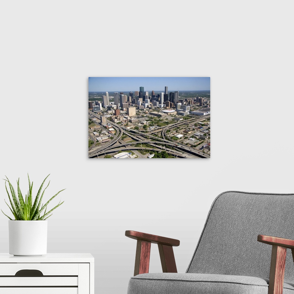 A modern room featuring Aerial view of the freeway interchange of Interstate 45 and U.S. Highway 59 in the city of Housto...