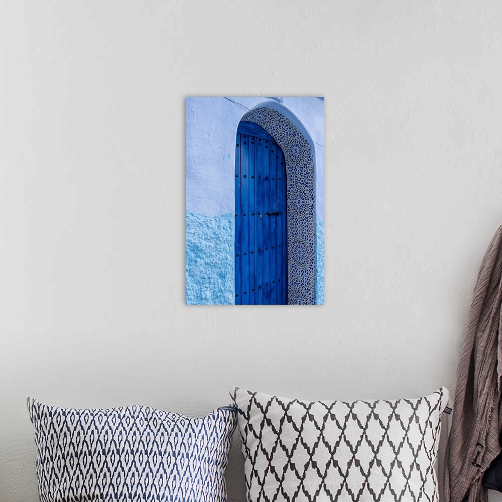 A bohemian room featuring Africa, Morocco, Chefchaouen. Arch over wooden door. Credit: Bill Young