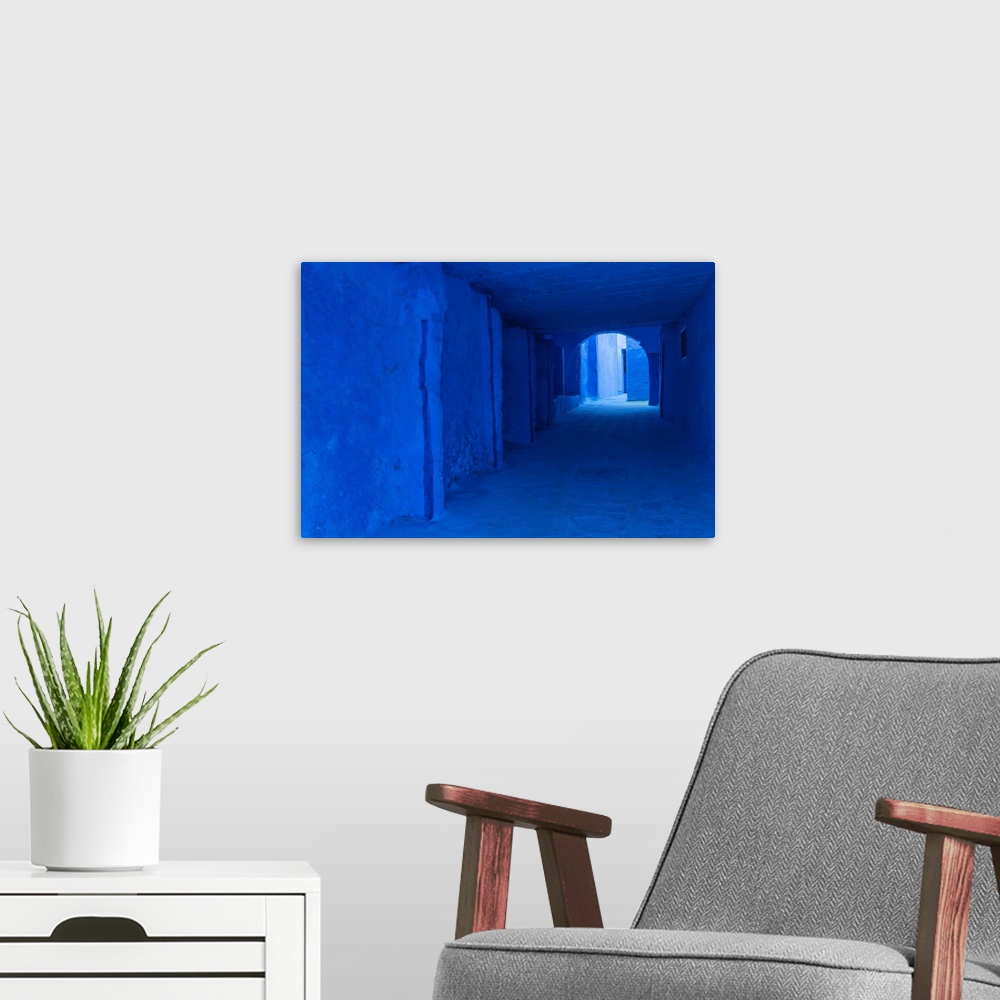 A modern room featuring Africa, Morocco, Chefchaouen. Blue-painted alley. Credit: Bill Young