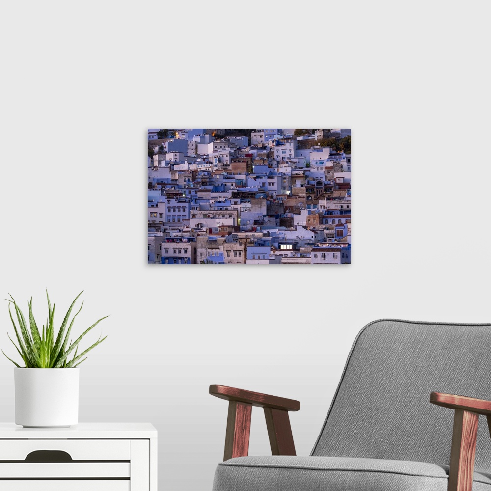 A modern room featuring Africa, Morocco, Chefchaouen. Overview of town at twilight. Credit: Bill Young