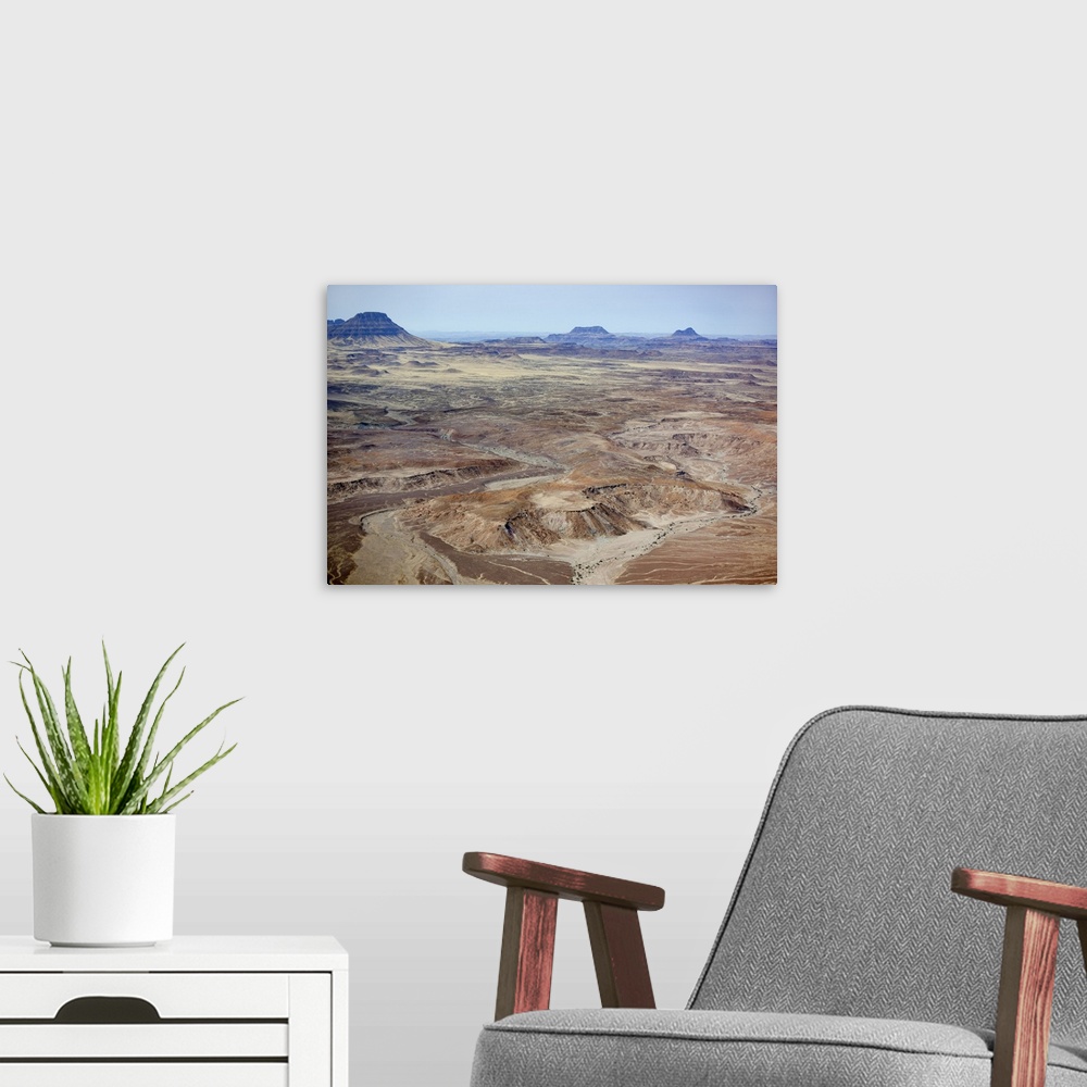 A modern room featuring Africa, Namibia, Damaraland. Aerial view of the mountains and red rocks of Damaraland.